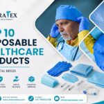 Doctor wearing gloves and cap with disposable medical supplies like masks, syringes, and gowns displayed